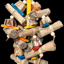 Load image into Gallery viewer, An exciting combination of easy to chew and shred banana leaf rolls, mahogany pod chunks, brightly colored mini softwood slats and small wood beads strung on jute cord from a wood dowel base. Designed for small up to medium sized birds who love softer textures.

