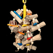 Load image into Gallery viewer, An exciting combination of easy to chew and shred banana leaf rolls, mahogany pod chunks, brightly colored mini softwood slats and small wood beads strung on jute cord from a wood dowel base. Designed for small up to medium sized birds who love softer textures.
