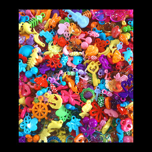 One pound of mixed acrylic charms in assorted shapes, sizes and colors. Mixture will consist of what we have in stock, so no two bags will be alike. Includes both solid and transparent (crystal) colors and many styles not shown on our website.