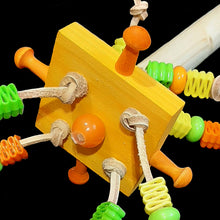 Load image into Gallery viewer, A 7-1/2 inch long (7/8" diameter) dowel perch with a spinning soft wood block filled with assorted beads knotted on veggie tanned leather and wood pegs for nibbling. A fun place for your bird to hang out and play at the same time!