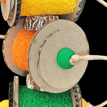 Load image into Gallery viewer, Three brightly colored loofah rolls flanked by corrugated cardboard rounds with wood beads, mahogany chunks and paper rope. The base of this toy is stainless steel wire. Designed for small to intermediate birds who like softer textures.  Measures approx 4&quot; by 11&quot; including link.
