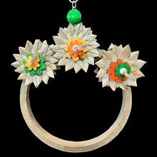 Load image into Gallery viewer, An adorable swing that doubles as a shreddable toy! Made on a large birdie bagel with six crunchy palm leaf flowers (three on each side) and brightly colored pine daisies and wood snap beads on jute cord. Designed for intermediate sized birds such as senegals, caiques, ringnecks, quakers or even a couple smaller birds.