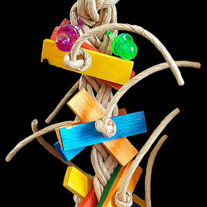 A big paper rope braid with lots of brightly colored pine wood slats and two acrylic pacifiers woven in. A fun toy to swing on as well!  Measures approx 5" by 16" including link.