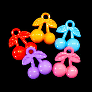 Acrylic cherry charms measuring approx 3/4" by 1" with a 3.5 mm (approx 1/8") hole.  Package contains 10 charms in assorted colors.