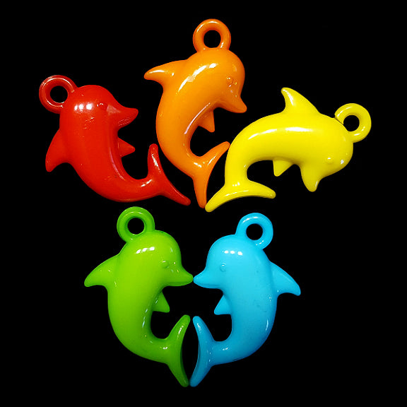 Acrylic charms in the shape of a dolphin measuring approx 3/4
