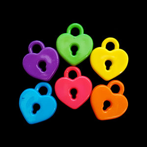 Acrylic heart lock charms measuring approx 3/4" by 7/8" with a 4mm (approx 5/32") hole.  Package contains 15 charms in assorted colors.