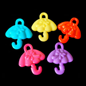 Small acrylic charms in the shape of an umbrella measuring approx 7/8" by 1" with a 3mm (approx 1/8") hole.  Package contains 25 charms in assorted colors.