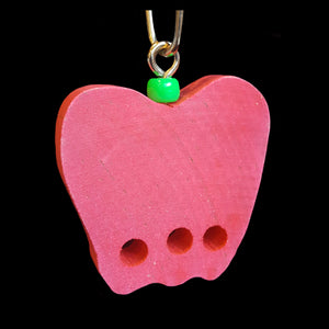 A brightly colored 2-1/4" by 1/2" thick hardwood apple with three 1/4" holes. Includes cool clip link for hanging.  Available in assorted colors.