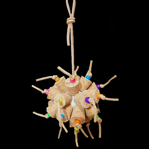 Another exciting toy for the cork lovers! Two dozen cork stoppers with pony beads tied onto a perforated golf ball base with twisted paper cord. The toy hangs from a strip of veggie tanned leather lace. Designed for intermediate sized birds such as small conures, cockatiels, quakers, ringnecks, etc. up to slightly bigger birds that like softer textured toys. Measures approx 5