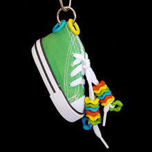 Load image into Gallery viewer, A miniature canvas tennis shoe decorated with colorful wiggle rings. Makes a great foraging toy - simply hide a treat or two inside for foraging fun! Note: Sneaker does not have metal grommets like some do!
