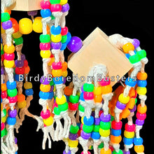 Load image into Gallery viewer, Just under 500 pony beads knotted on cotton from pine wood blocks on stainless steel wire that spin, wiggle and jiggle! Topped off with a mini plastic nut &amp; bolt set for more interactive fun. Our experience has shown bead toys help feather pickers and are a great starter for birds that don&#39;t know how to play with toys.  Measures approx 7&quot; by 14&quot; including link.
