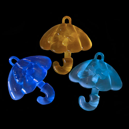 Large, flat, crystal colored charms in the shape of an umbrella with a bow measuring approx 1-1/2