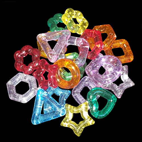 Little crystal-colored rings in assorted shapes (heart, star, flower, triangle, square and others) measuring approx 5/8