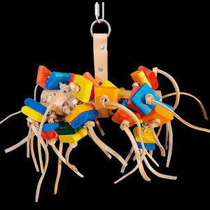 A large roll of veggie tanned leather with brightly colored wood blocks tied onto thick, veggie tanned leather strips. For added foraging fun, treats can be hidden inside the roll for your bird to find. A great toy for leather lovers!