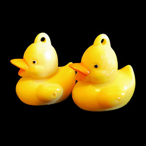 Solid rubber ducks approx 1" long with a small hole in the top. Can be used as a toy base by inserting a screw eye in the bottom.