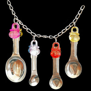 Four stainless steel measuring spoons with colorful acrylic charms linked on nickel plated chain with cool clip links on each end. This toy can be hung either horizontally or vertically in your bird's cage.  Measures approx 11" including links.
