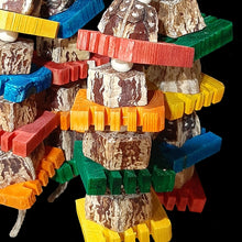 Load image into Gallery viewer, Bird toy with mahogany pod chunks, brightly colored notched pine busy beaver slices and small wood snap beads flowing under a wood dowel base on jute cord. Hangs on a short length of nickel plated chain with more wood pieces. Designed for intermediate to medium sized birds who like softer textures.
