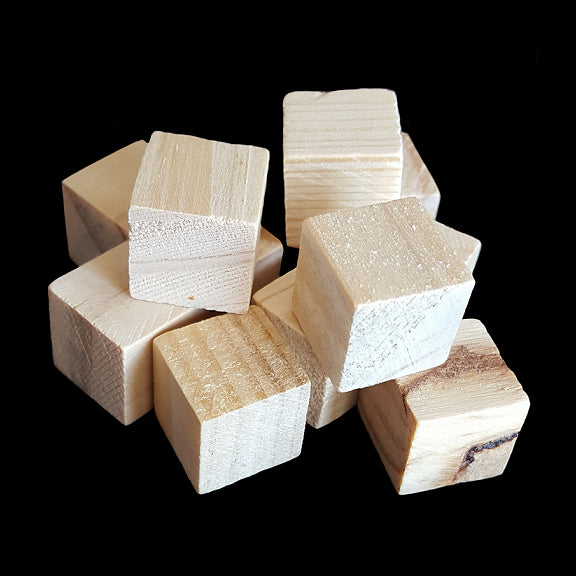 Small, uncolored hard wood cubes measuring approx 5/8