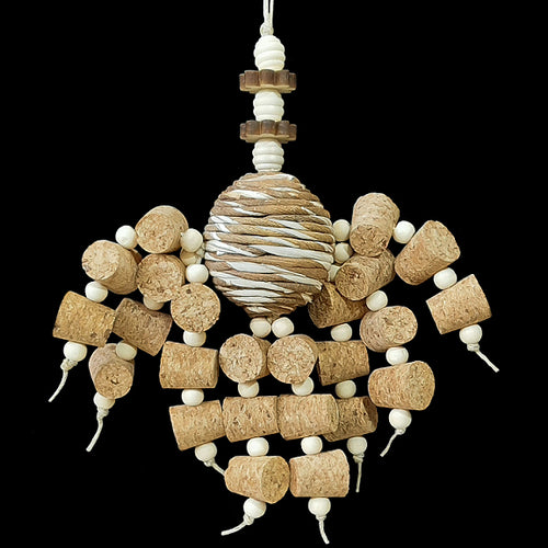 Two dozen corks with little wood snap beads dangling from a sola rope ball center with natural wood beads and shapes. Designed for small to intermediate sized birds.  Measures approx 7