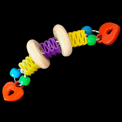 Brightly colored ribbon candy beads, charms, pony beads and natural wood wheels on nickel plated chain. Designed for intermediate up to medium sized birds from conures and quakers up to african greys. Measures approx 4-1/2