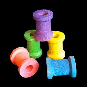 Small brightly coloured wood spools measuring 1/2" by 5/8" with a 1/4" hole.