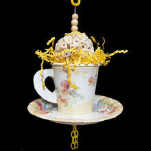 Load image into Gallery viewer, Your bird is sure to have a party with this super-soft sola ball nestled inside a paper tea cup and saucer! The cup is stuffed with crinkle paper shred and has a cork stopper hidden inside. Strung on stainless steel wire with small wood snap beads and plastic chain. Designed for small to intermediate sized birds.  Measures approx 3&quot; wide at the top, 5-1/2&quot; wide at the saucer and 10&quot; from top of link to the bottom of the chain.
