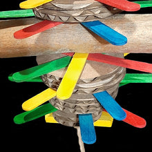 Load image into Gallery viewer, Bird toy made with popsicle sticks, cardboard rounds and a natural sola stick with bark stacked together on paper rope.

