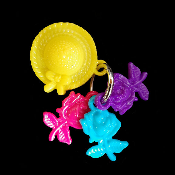 Designed for little beaks and feet! A light-weight foot toy made with acrylic flower charms attached to a sun bonnet charm. Designed for small parrots such as green cheek conures, cockatiels or other birds that like to fiddle with foot toys.