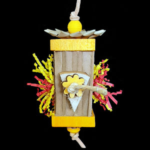 A bright & fun shredding toy made with a variety of different textures! The base is a shreddable cardboard honeycomb block with balsa, yucca, pine daisies, wood beads, crinkle cut paper shred, sisal rope and a palm leaf flower strung on veggie tanned leather lace. Designed for small to intermediate sized birds as well as bunnies.