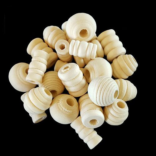 An assortment of uncolored wood beads in different shapes. Sizes depend on the shape, but average approx 3/4
