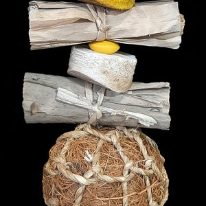Bundles of banana leaf rolls, soft yucca pieces, wood beads and a coconut fiber ball on stainless steel wire. The coco ball is made from coconut fiber that has been bundled and rolled into a tight ball with seagrass cord twisted around the outside. Designed for small to intermediate sized birds.  Measures approx 3" by 11" including link.