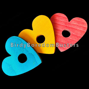 Brightly colored soft wood pine hearts measuring 1-3/4" by 1/4" thick with a 3/8" center hole.  Package contains 10 hearts in assorted colors.