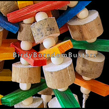 Load image into Gallery viewer, Lots of brightly colored mini pine slats, super soft sola and little wood snap beads hanging under a yucca base. Designed for birds who love soft wood and shredding. An instant hit with my budgies!  Measures approx 4&quot; by 11&quot; including link. 
